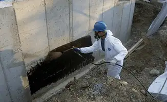 Professional waterproofing the exterior walls of the basement in Atlanta, GA