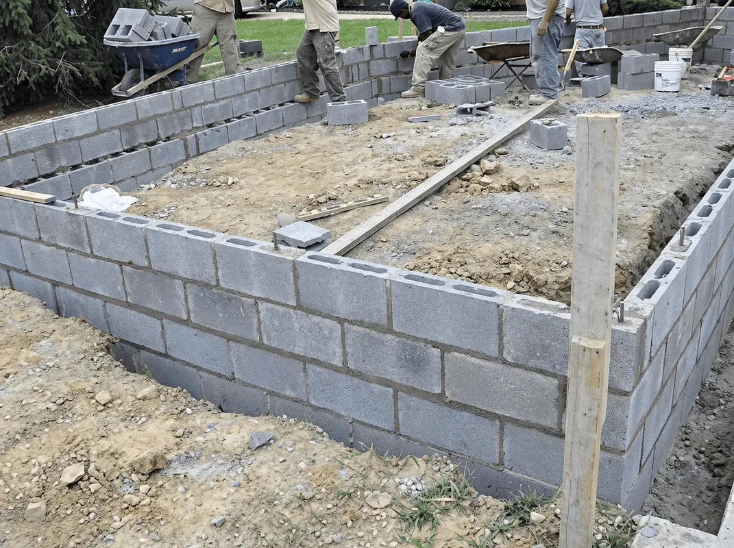 Professionals building a foundation with blocks in Atlanta, GA